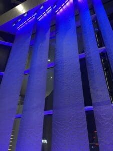 This water feature is another view of the five metal mesh panels that have blue down lighting and purple up lighting. You can see the water ripple down the panels.